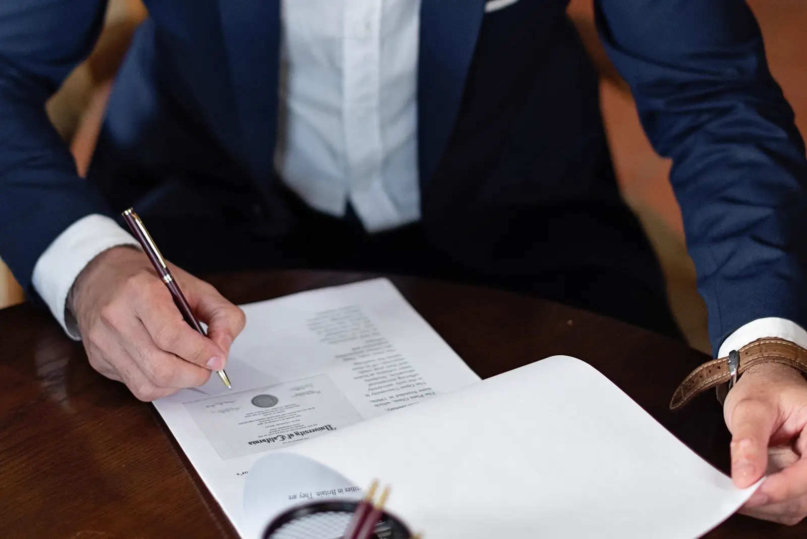 A client reviewing documents carefully before signing
